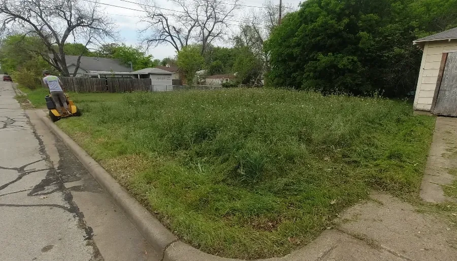 Patchy backyard with bare spots before service